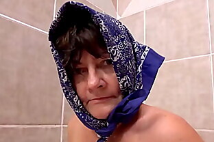 ugly 73 years old granny peeing at the bathtub poster
