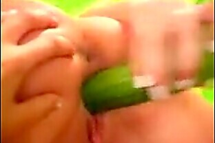 two teen lesbians pleasure themselves with a vegetable to orgasm