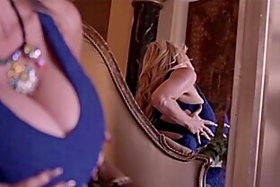Sexy MILF Kelly Madison Shakes Her Huge Boobs In A Blue Dress poster