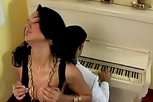 Awesome young beauty in black slinky evening dress Julia Paes dreams about hot nasty sex with muscular gentleman in white suit