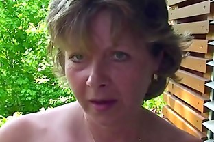 Busty MILF shows her pussy in a close-up poster