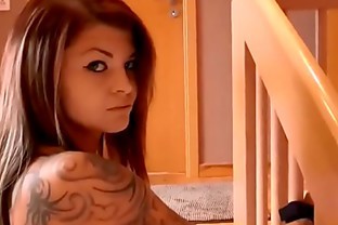 Busty tattooed brunette tied and fucked on the stairs