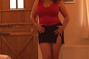 Busty mature brunette in mini skirt panty play