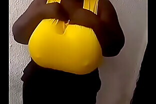 Huge breasted African girl dancing