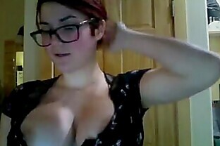 This brunette with glasses shows flash her big boobs