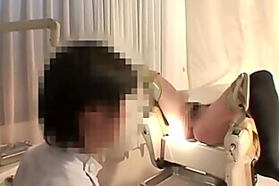 Peeking at the medical examination of a pregnant woman with a large areola and stomach