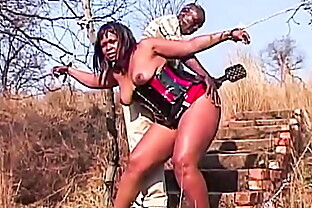 Big tits curvy African town slut tied and spanked in outdoor park